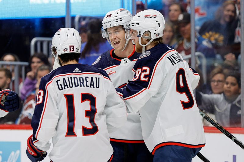 Mar 22, 2024; Denver, Colorado, USA; Columbus Blue Jackets defenseman Damon Severson (78) celebrates his goal with left wing Alexander Nylander (92) and left wing Johnny Gaudreau (13) in the first period against the Colorado Avalanche at Ball Arena. Mandatory Credit: Isaiah J. Downing-USA TODAY Sports