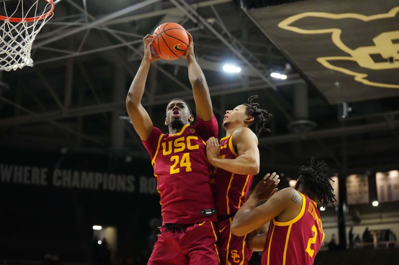 Feb 23, 2023; Boulder, Colorado, USA; USC Trojans forward Joshua Morgan (24) pulls in a rebound in the first half against the Colorado Buffaloes at the CU Events Center. Mandatory Credit: Ron Chenoy-USA TODAY Sports