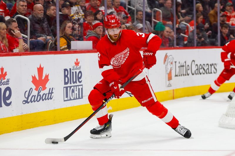 Dec 31, 2023; Detroit, Michigan, USA; Detroit Red Wings left wing J.T. Compher (37) handles the puck during the second period of the game between the Boston Bruins and the Detroit Red Wings at Little Caesars Arena. Mandatory Credit: Brian Bradshaw Sevald-USA TODAY Sports