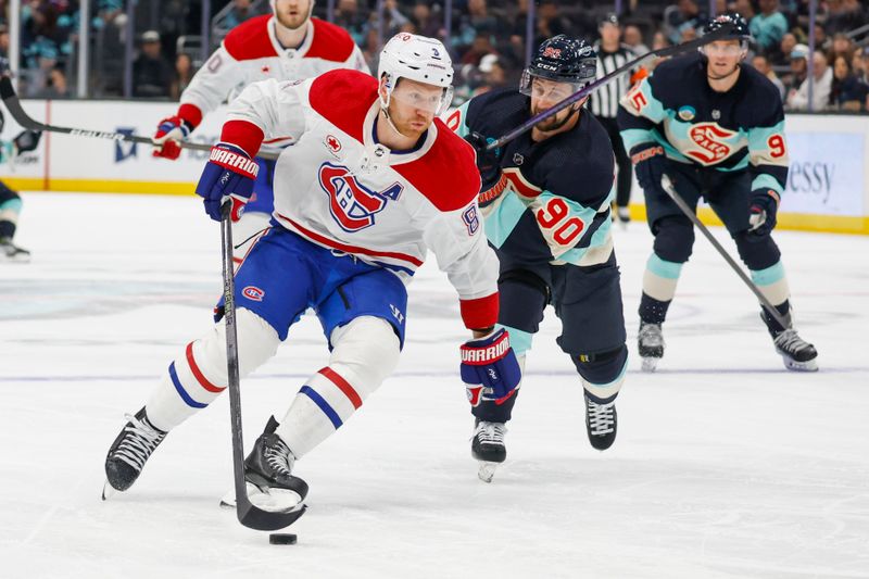 Mar 24, 2024; Seattle, Washington, USA; Montreal Canadiens defenseman Mike Matheson (8) skates with the puck ahead of Seattle Kraken left wing Tomas Tatar (90) during the second period at Climate Pledge Arena. Mandatory Credit: Joe Nicholson-USA TODAY Sports