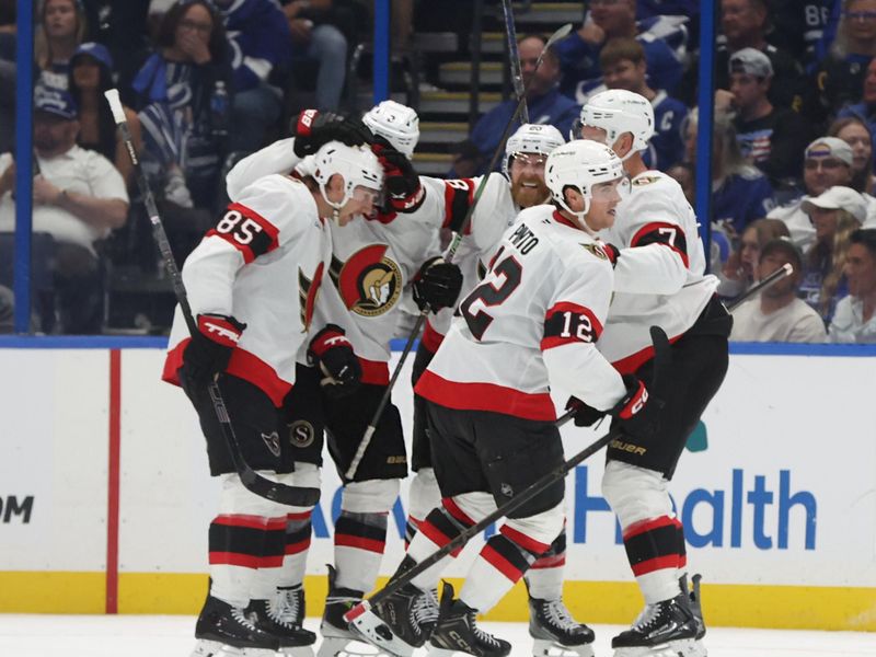 Oct 9, 2025; Tampa, Florida, USA; Ottawa Senators center Shane Pinto (12) is congratulated after he scored a goal against the Tampa Bay Lightning during the third period at Benchmark International Arena. Mandatory Credit: Kim Klement Neitzel-Imagn Images