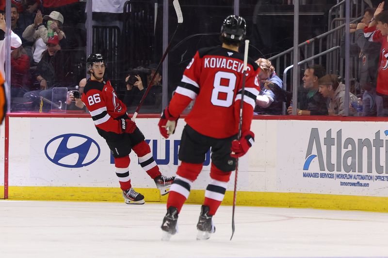 Nov 7, 2024; Newark, New Jersey, USA; New Jersey Devils center Jack Hughes (86) celebrates his goal against the Montreal Canadiens during the third period at Prudential Center. Mandatory Credit: Ed Mulholland-Imagn Images