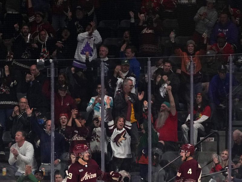 Mar 18, 2023; Tempe, Arizona, USA; Arizona Coyotes defenseman Juuso Valimaki (4) celebrates his goal against the Chicago Blackhawks during the third period at Mullett Arena. Mandatory Credit: Joe Camporeale-USA TODAY Sports