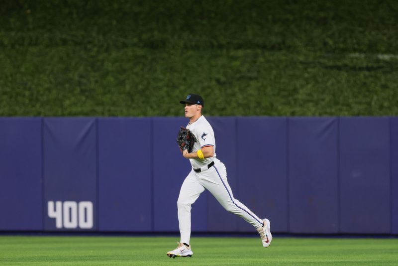 Sep 4, 2024; Miami, Florida, USA; Miami Marlins right fielder Griffin Conine (56) runs toward the dugout against the Washington Nationals during the third inning at loanDepot Park. Mandatory Credit: Sam Navarro-Imagn Images