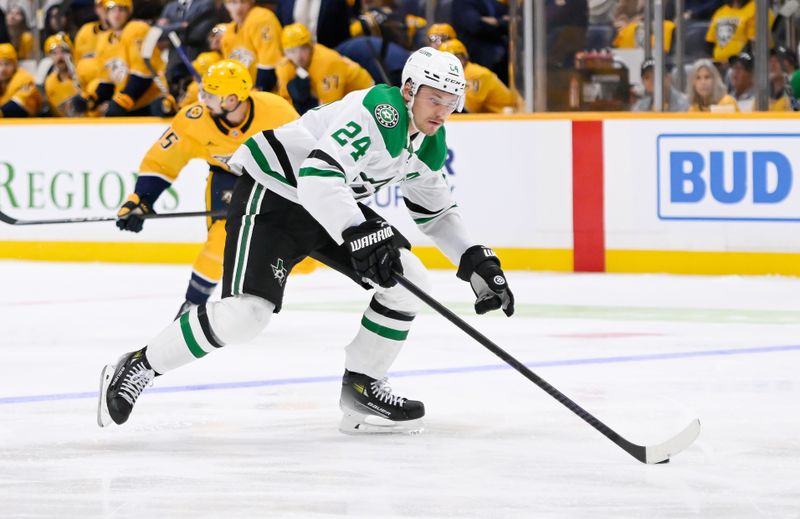 Oct 10, 2024; Nashville, Tennessee, USA; Dallas Stars center Roope Hintz (24) skates with the puck against the Nashville Predators during the second period at Bridgestone Arena. Mandatory Credit: Steve Roberts-Imagn Images