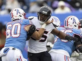 Houston Texans defensive end Danielle Hunter (55) rushes as he's blocked by Tennessee Titans offensive tackle Daniel Brunskill (60) during their NFL football game Sunday, Jan. 5, 2025, in Nashville, Tenn. (AP Photo/Wade Payne)