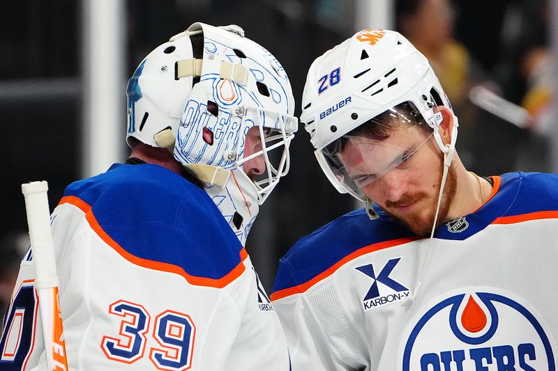 Mar 8, 2026; Las Vegas, Nevada, USA; Edmonton Oilers center Jack Roslovic (28) congratulates goaltender Connor Ingram (39) after the Oilers defeated the Vegas Golden Knights 4-2 at T-Mobile Arena. Mandatory Credit: Stephen R. Sylvanie-Imagn Images