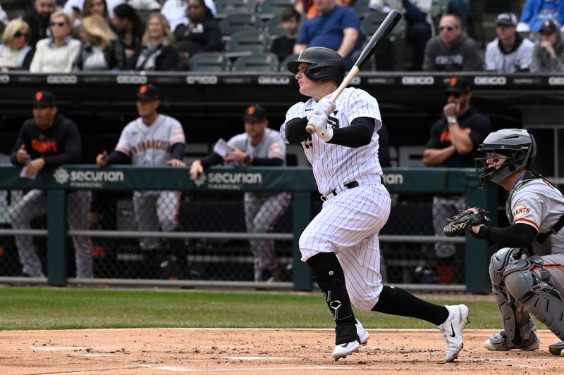 Apr 5, 2023; Chicago, Illinois, USA;  Chicago White Sox first baseman Andrew Vaughn (25) hits an RBI double against the San Francisco Giants during the first inning at Guaranteed Rate Field. Mandatory Credit: Matt Marton-USA TODAY Sports