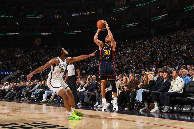 SAN FRANCISCO, CA - NOVEMBER 25: Stephen Curry #30 of the Golden State Warriors shoots a three point basket during the game against the Brooklyn Nets on November 25, 2024 at Chase Center in San Francisco, California. NOTE TO USER: User expressly acknowledges and agrees that, by downloading and or using this photograph, user is consenting to the terms and conditions of Getty Images License Agreement. Mandatory Copyright Notice: Copyright 2024 NBAE (Photo by Noah Graham/NBAE via Getty Images)