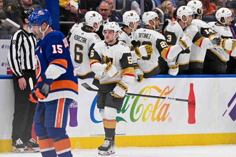 Jan 23, 2024; Elmont, New York, USA;  Vegas Golden Knights right wing Sheldon Rempal (56) celebrates his goal against the New York Islanders during the second period at UBS Arena. Mandatory Credit: Dennis Schneidler-USA TODAY Sports