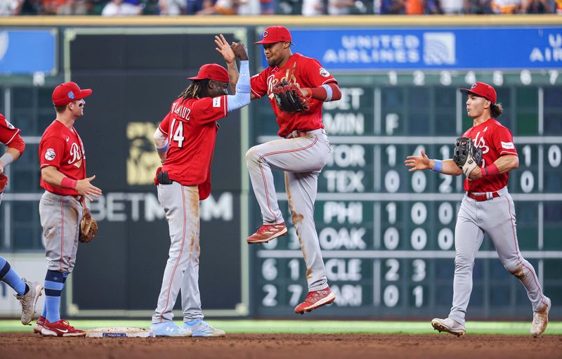 Jun 18, 2023; Houston, Texas, USA; Cincinnati Reds right fielder Will Benson (30) celebrates with shortstop Elly De La Cruz (44) after the game against the Houston Astros at Minute Maid Park. Mandatory Credit: Troy Taormina-USA TODAY Sports