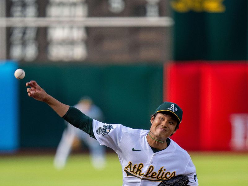 Jun 13, 2023; Oakland, California, USA; Oakland Athletics starting pitcher Shintaro Fujinami (11) delivers a pitch against the Tampa Bay Rays during the first inning at Oakland-Alameda County Coliseum. Mandatory Credit: Neville E. Guard-USA TODAY Sports