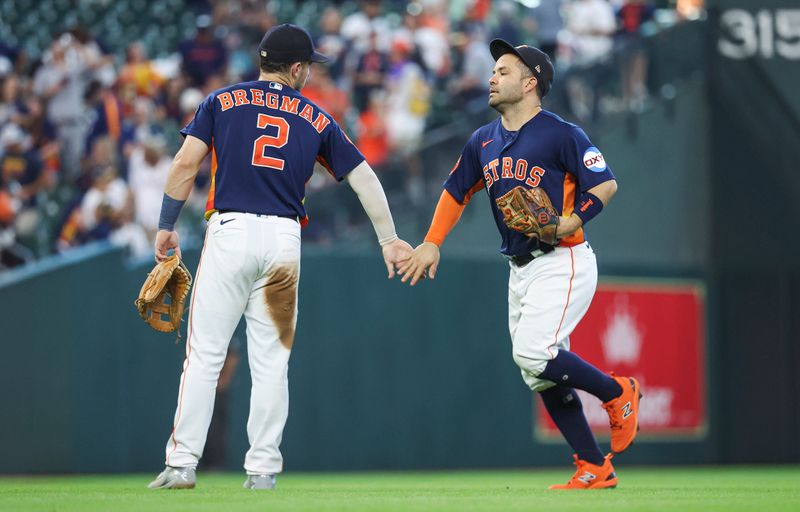 Sep 10, 2023; Houston, Texas, USA; Houston Astros second baseman Jose Altuve (27) celebrates with third baseman Alex Bregman (2) after the game against the San Diego Padres at Minute Maid Park. Mandatory Credit: Troy Taormina-USA TODAY Sports