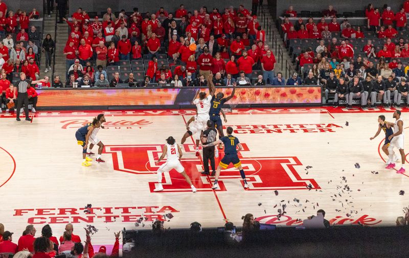 Jan 6, 2024; Houston, Texas, USA;Houston Cougars forward Ja'Vier Francis (5) jumps against West Virginia Mountaineers forward Akok Akok (13) on the opening tip off in the first half  at Fertitta Center. Mandatory Credit: Thomas Shea-USA TODAY Sports