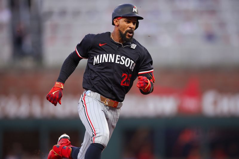 Apr 19, 2025; Atlanta, Georgia, USA; Minnesota Twins center fielder Byron Buxton (25) runs to third on a triple against the Atlanta Braves in the third inning at Truist Park. Mandatory Credit: Brett Davis-Imagn Images