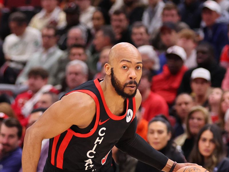 CHICAGO, ILLINOIS - JANUARY 30: Jevon Carter #5 of the Chicago Bulls drives to the basket against the Toronto Raptors during the first half at the United Center on January 30, 2024 in Chicago, Illinois. NOTE TO USER: User expressly acknowledges and agrees that, by downloading and or using this photograph, User is consenting to the terms and conditions of the Getty Images License Agreement.  (Photo by Michael Reaves/Getty Images)