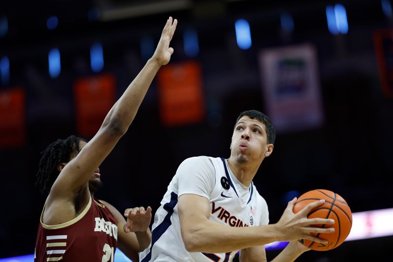 Jan 28, 2023; Charlottesville, Virginia, USA; Virginia Cavaliers forward Kadin Shedrick (21) prepares to shoot the ball as Boston College Eagles forward Devin McGlockton (21) defends in the second half at John Paul Jones Arena. Mandatory Credit: Geoff Burke-USA TODAY Sports