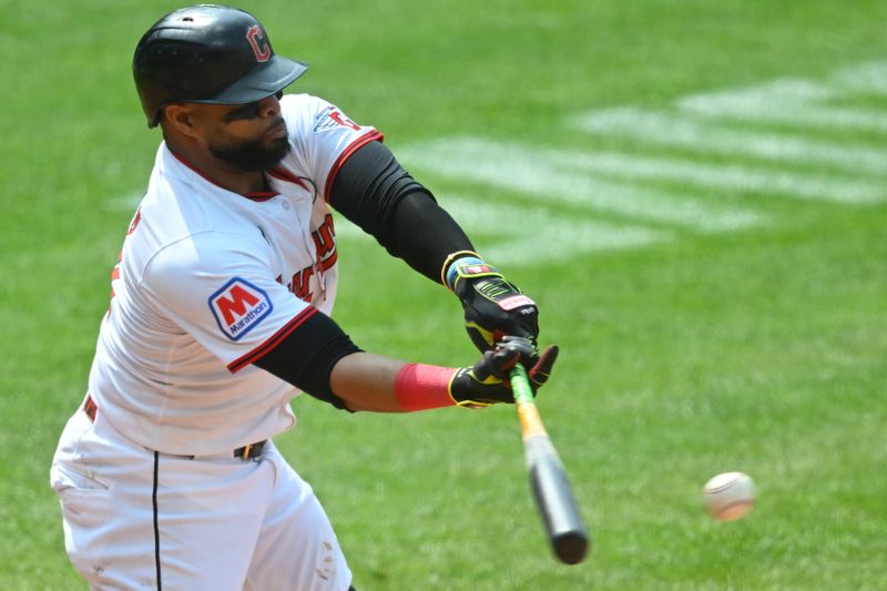 Jun 1, 2025; Cleveland, Ohio, USA; Cleveland Guardians first baseman Carlos Santana (41) singles in the seventh inning against the Los Angeles Angels at Progressive Field. Mandatory Credit: David Richard-Imagn Images
