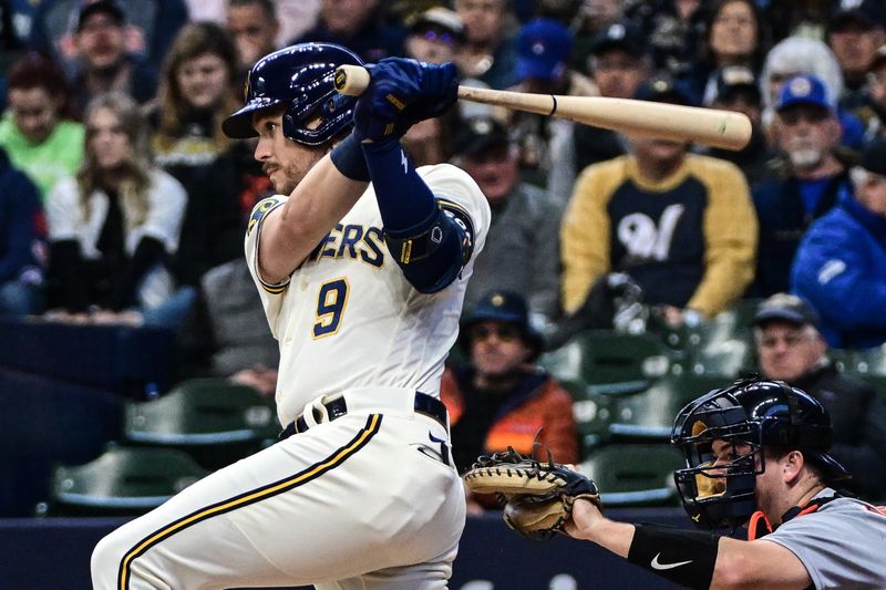 Apr 26, 2023; Milwaukee, Wisconsin, USA; Milwaukee Brewers right fielder Brian Anderson (9) hits a two-run RBI single in the first inning during game against Detroit Tigers at American Family Field. Mandatory Credit: Benny Sieu-USA TODAY Sports