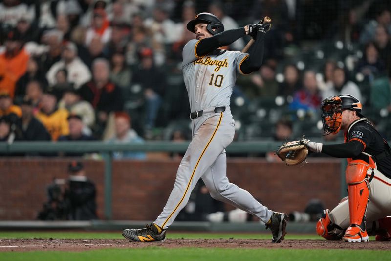 Apr 27, 2024; San Francisco, California, USA; Pittsburgh Pirates left fielder Bryan Reynolds (10) hits a home run against the San Francisco Giants during the tenth inning at Oracle Park. Mandatory Credit: Darren Yamashita-USA TODAY Sports