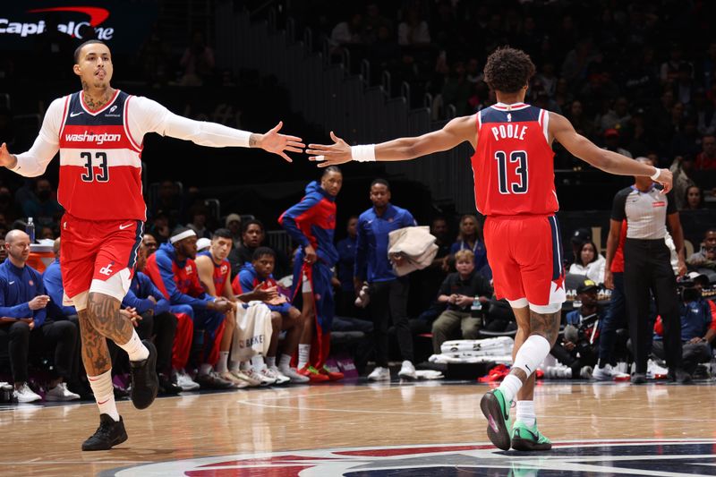 WASHINGTON, DC -? NOVEMBER 17: Kyle Kuzma #33 and Jordan Poole #13 of the Washington Wizards high five during the game against the Detroit Pistons on November 17, 2024 at Capital One Arena in Washington, DC. NOTE TO USER: User expressly acknowledges and agrees that, by downloading and or using this Photograph, user is consenting to the terms and conditions of the Getty Images License Agreement. Mandatory Copyright Notice: Copyright 2024 NBAE (Photo by Stephen Gosling/NBAE via Getty Images)