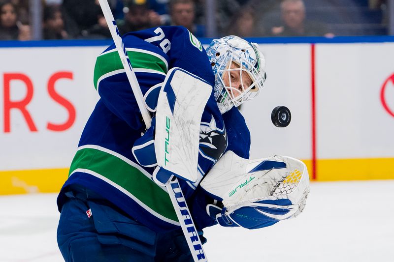 Mar 16, 2024; Vancouver, British Columbia, CAN; Vancouver Canucks goalie Casey DeSmith (29) makes a save against the Washington Capitals in the second period at Rogers Arena. Mandatory Credit: Bob Frid-USA TODAY Sports