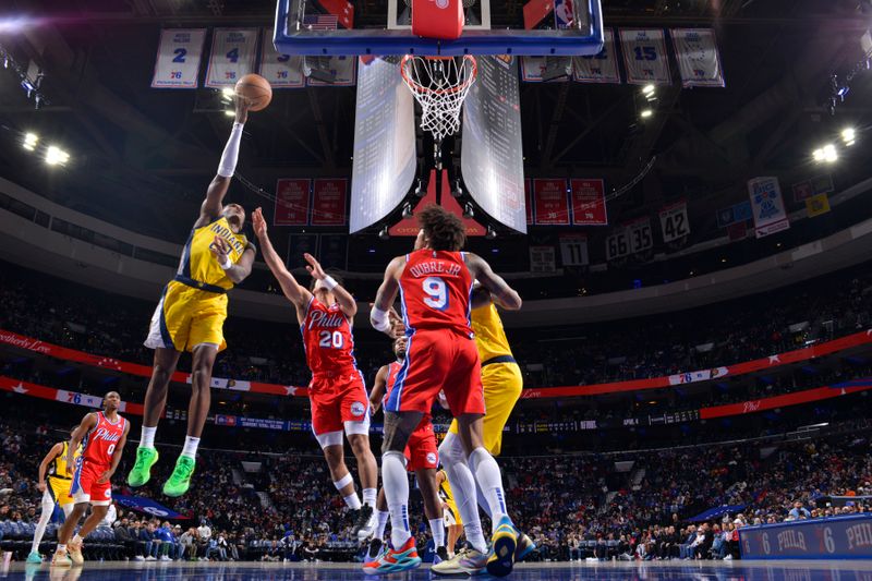 PHILADELPHIA, PA - DECEMBER 13: Bennedict Mathurin #00 of the Indiana Pacers drives to the basket during the game against the Philadelphia 76ers on December 13, 2024 at the Wells Fargo Center in Philadelphia, Pennsylvania NOTE TO USER: User expressly acknowledges and agrees that, by downloading and/or using this Photograph, user is consenting to the terms and conditions of the Getty Images License Agreement. Mandatory Copyright Notice: Copyright 2024 NBAE (Photo by Jesse D. Garrabrant/NBAE via Getty Images)