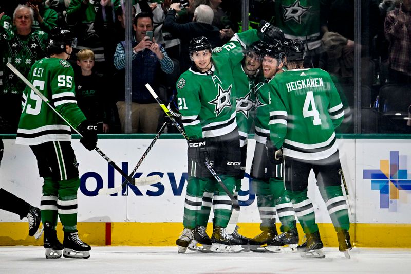 Mar 22, 2024; Dallas, Texas, USA; Dallas Stars defenseman Thomas Harley (55) and left wing Jason Robertson (21) and center Joe Pavelski (16) and center Roope Hintz (24) and defenseman Miro Heiskanen (4) celebrates a goal scored by Pavelski against the Pittsburgh Penguins during the first period at the American Airlines Center. Mandatory Credit: Jerome Miron-USA TODAY Sports