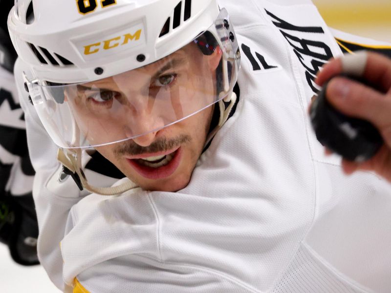 Jan 17, 2025; Buffalo, New York, USA;  Pittsburgh Penguins center Sidney Crosby (87) waits for the linesman to drop the puck for a face-off during the first period against the Buffalo Sabres at KeyBank Center. Mandatory Credit: Timothy T. Ludwig-Imagn Images