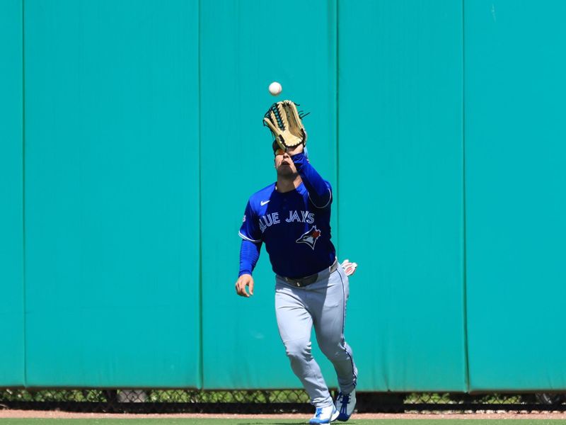 Mar 7, 2026; Clearwater, Florida, USA;  Toronto Blue Jays center fielder Daulton Varsho (5) catches a fly ball during the third inning against the Philadelphia Phillies at BayCare Ballpark. Mandatory Credit: Kim Klement Neitzel-Imagn Images