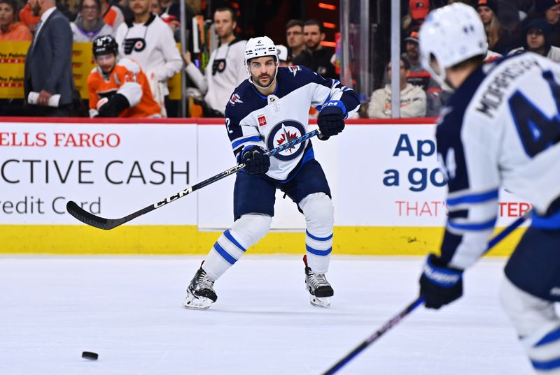 Jan 22, 2023; Philadelphia, Pennsylvania, USA; Winnipeg Jets defenseman Dylan DeMelo (2) passes the puck against the Philadelphia Flyers in the second period at Wells Fargo Center. Mandatory Credit: Kyle Ross-USA TODAY Sports