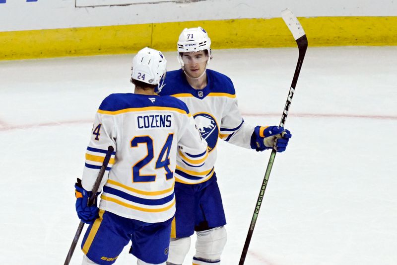 Oct 19, 2024; Chicago, Illinois, USA;  Buffalo Sabres center Ryan McLeod (71) celebrates with center Dylan Cozens (24) after an empty net goal against the Chicago Blackhawks during the third period at the United Center. Mandatory Credit: Matt Marton-Imagn Images