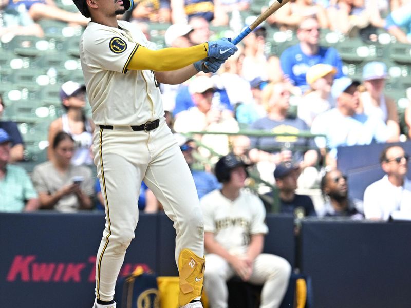 Jun 12, 2024; Milwaukee, Wisconsin, USA; Milwaukee Brewers shortstop Willy Adames (27) hits a home run against the Toronto Blue Jays in the sixth inning at American Family Field. Mandatory Credit: Michael McLoone-USA TODAY Sports