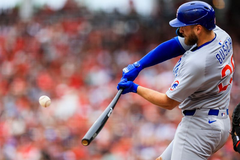 May 25, 2025; Cincinnati, Ohio, USA; Chicago Cubs first baseman Michael Busch (29) hits a RBI single in the seventh inning against the Cincinnati Reds at Great American Ball Park. Mandatory Credit: Katie Stratman-Imagn Images