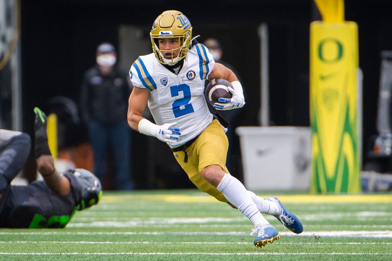 Nov 21, 2020; Eugene, Oregon, USA; UCLA Bruins wide receiver Kyle Philips (2) picks up a first down during the first half against the Oregon Ducks at Autzen Stadium. The Ducks won 38-35. Mandatory Credit: Troy Wayrynen-USA TODAY Sports