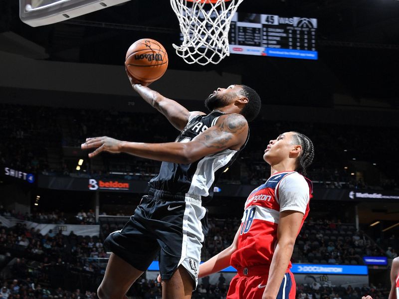 SAN ANTONIO, TX - NOVEMBER 13: Blake Wesley #14 of the San Antonio Spurs drives to the basket during the game against the Washington Wizards on November 13, 2024 at the Frost Bank Center in San Antonio, Texas. NOTE TO USER: User expressly acknowledges and agrees that, by downloading and or using this photograph, user is consenting to the terms and conditions of the Getty Images License Agreement. Mandatory Copyright Notice: Copyright 2024 NBAE (Photos by Michael Gonzales/NBAE via Getty Images)