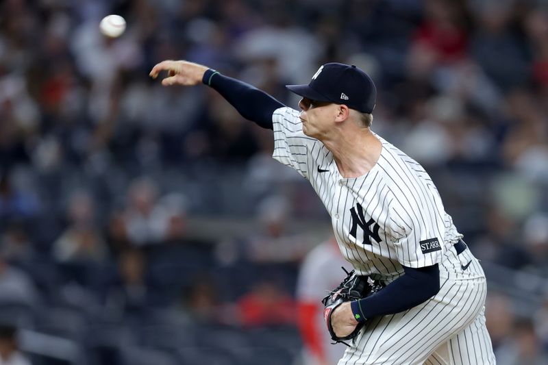 Jun 7, 2025; Bronx, New York, USA; New York Yankees relief pitcher Ian Hamilton (71) pitches against the Boston Red Sox during the ninth inning at Yankee Stadium. Mandatory Credit: Brad Penner-Imagn Images