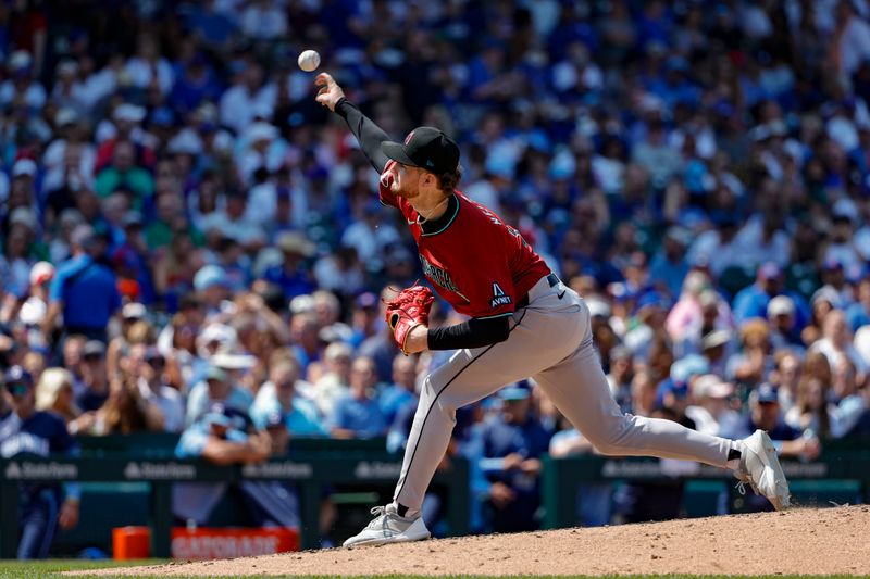 Jul 19, 2024; Chicago, Illinois, USA; Arizona Diamondbacks starting pitcher Ryne Nelson (19) delivers a pitch against the Chicago Cubs during the fifth inning at Wrigley Field. Mandatory Credit: Kamil Krzaczynski-USA TODAY Sports