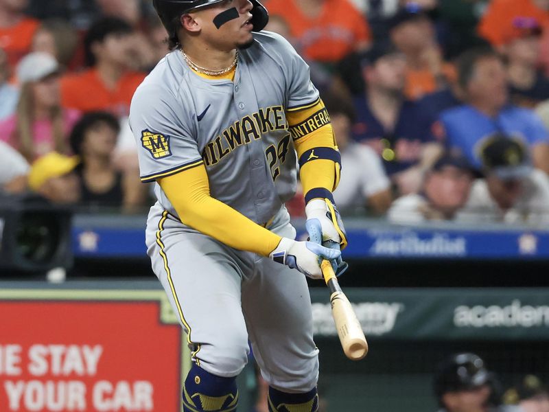 May 18, 2024; Houston, Texas, USA; Milwaukee Brewers catcher William Contreras (24) hits a three-run home run against the Houston Astros in the fifth inning at Minute Maid Park. Mandatory Credit: Thomas Shea-USA TODAY Sports