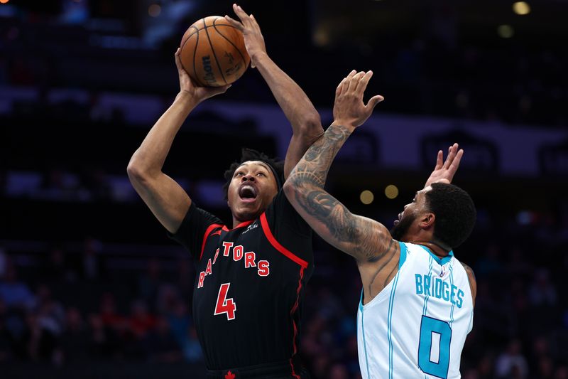 CHARLOTTE, NORTH CAROLINA - FEBRUARY 07: Scottie Barnes #4 of the Toronto Raptors attempts a shot against Miles Bridges #0 of the Charlotte Hornets during the first half of the game at Spectrum Center on February 07, 2024 in Charlotte, North Carolina. NOTE TO USER: User expressly acknowledges and agrees that, by downloading and or using this photograph, User is consenting to the terms and conditions of the Getty Images License Agreement. (Photo by Jared C. Tilton/Getty Images)