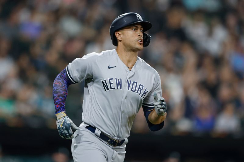 Aug 9, 2023; Chicago, Illinois, USA; New York Yankees designated hitter Giancarlo Stanton (27) rounds the bases after hitting a solo home run against the Chicago White Sox during the seventh inning at Guaranteed Rate Field. Mandatory Credit: Kamil Krzaczynski-USA TODAY Sports