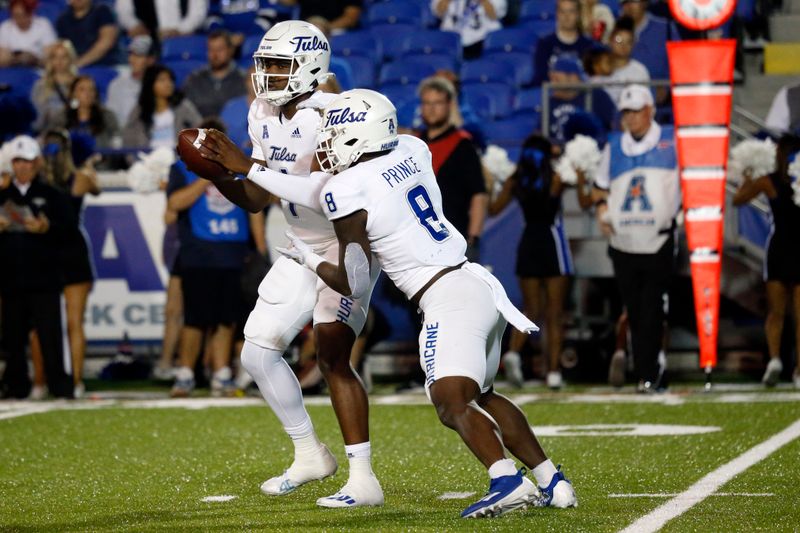 Nov 10, 2022; Memphis, Tennessee, USA; Tulsa Golden Hurricane quarterback Braylon Braxton (1) hands the ball off to running back Deneric Prince (8) during the first half against the Memphis Tigers at Liberty Bowl Memorial Stadium. Mandatory Credit: Petre Thomas-USA TODAY Sports