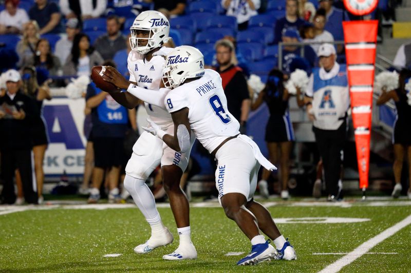 Nov 10, 2022; Memphis, Tennessee, USA; Tulsa Golden Hurricane quarterback Braylon Braxton (1) hands the ball off to running back Deneric Prince (8) during the first half against the Memphis Tigers at Liberty Bowl Memorial Stadium. Mandatory Credit: Petre Thomas-USA TODAY Sports