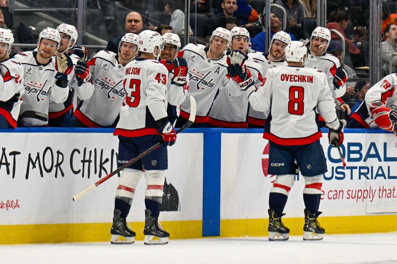 Nov 30, 2025; Elmont, New York, USA;  Washington Capitals right wing Tom Wilson (43) celebrates his goal against the New York Islanders during the first period at UBS Arena. Mandatory Credit: Dennis Schneidler-Imagn Images