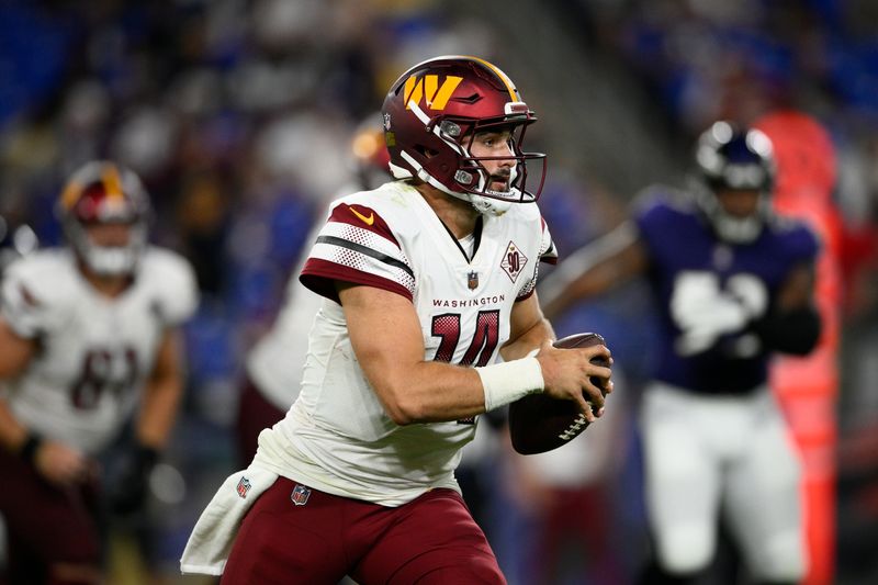 Washington Commanders quarterback Sam Howell (14) in action in the second half of a preseason NFL football game against the Baltimore Ravens, Saturday, Aug. 27, 2022, in Baltimore. (AP Photo/Nick Wass)