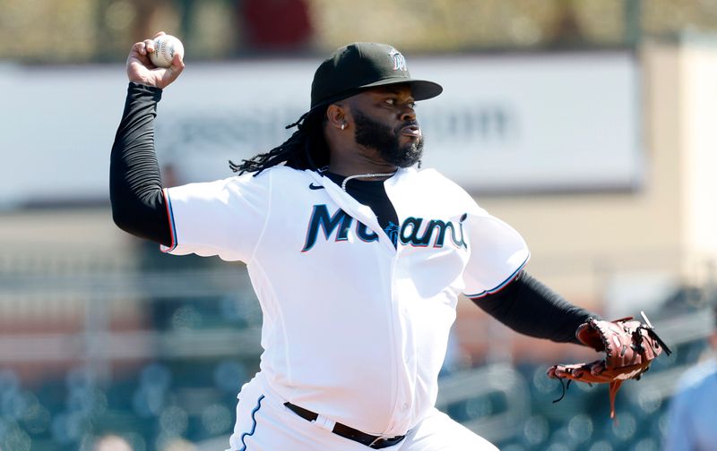 Feb 26, 2023; Jupiter, Florida, USA;  Miami Marlins starting pitcher Johnny Cueto (47) pitches in the fist inning against the St. Louis Cardinals at Roger Dean Stadium. Mandatory Credit: Rhona Wise-USA TODAY Sports