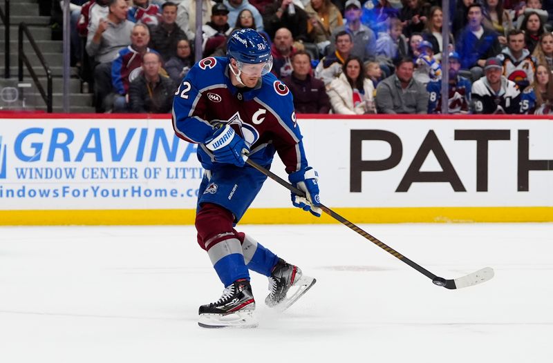 Nov 13, 2025; Denver, Colorado, USA; Colorado Avalanche left wing Gabriel Landeskog (92) prepares to shoot the puck in the second period against the Buffalo Sabres at Ball Arena. Mandatory Credit: Ron Chenoy-Imagn Images