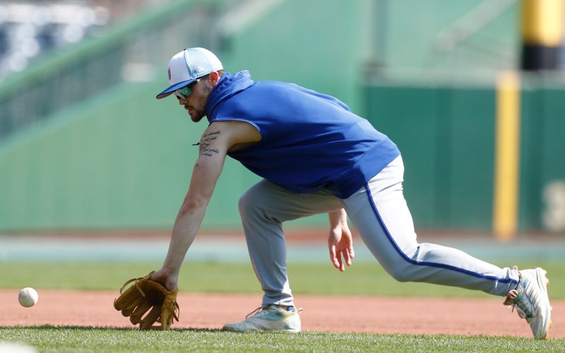 Sep 14, 2024; Pittsburgh, Pennsylvania, USA; Kansas City Royals shortstop Bobby Witt Jr. (7) takes ground balls before a game against the Pittsburgh Pirates at PNC Park. Mandatory Credit: Charles LeClaire-Imagn Images