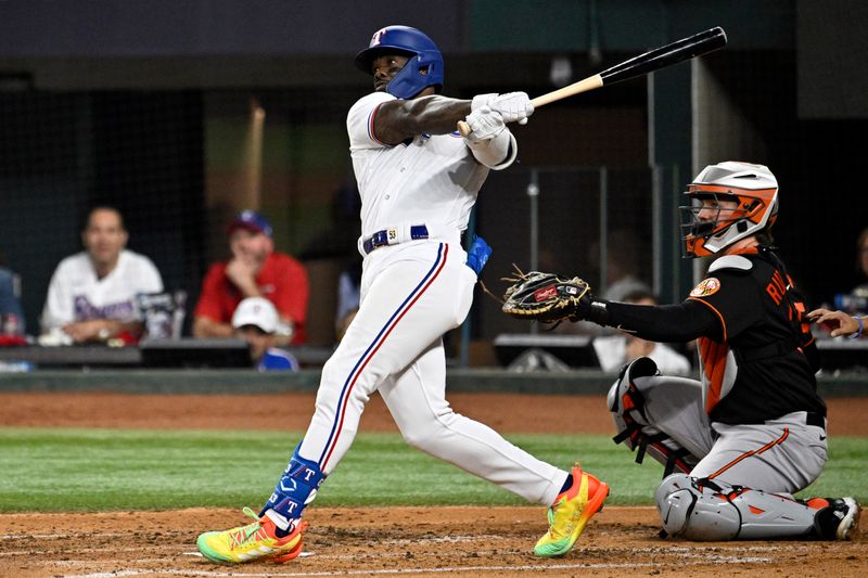 Oct 10, 2023; Arlington, Texas, USA; Texas Rangers right fielder Adolis Garcia (53) hits a three run home run against the Baltimore Orioles in the second inning during game three of the ALDS for the 2023 MLB playoffs at Globe Life Field. Mandatory Credit: Jerome Miron-USA TODAY Sports