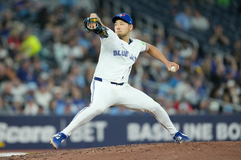 Apr 16, 2024; Toronto, Ontario, CAN; Toronto Blue Jays starting pitcher Yusei Kikuchi (16) pitches to the New York Yankees during the fifth inning at Rogers Centre. Mandatory Credit: John E. Sokolowski-USA TODAY Sports